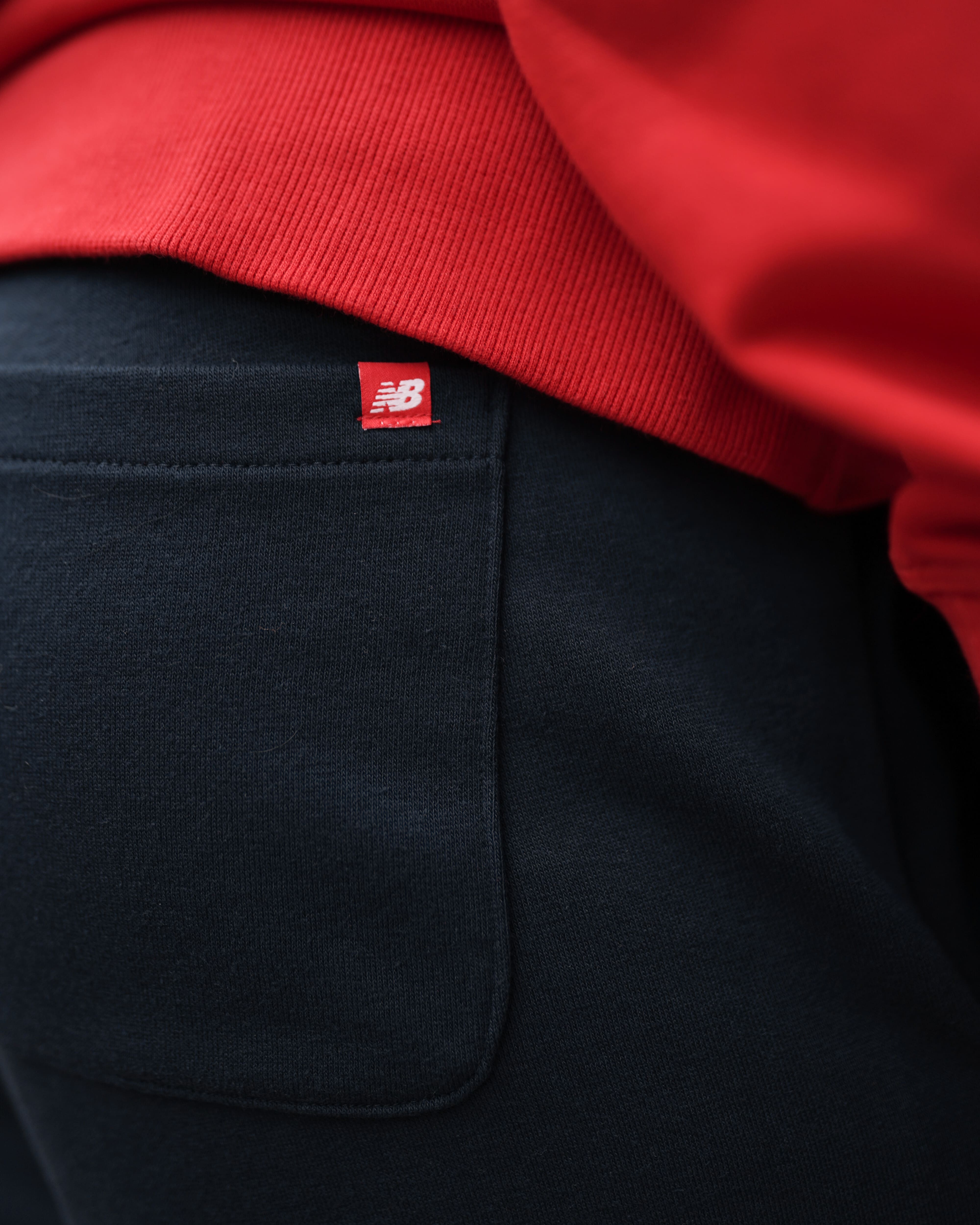 Брюки New Balance NB Ess Stacked Logo Чоловіки р.M